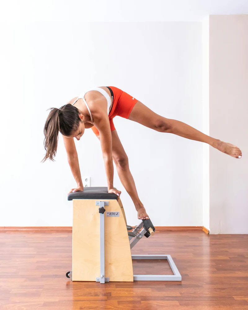 Woman on wunda chair doing Pilates