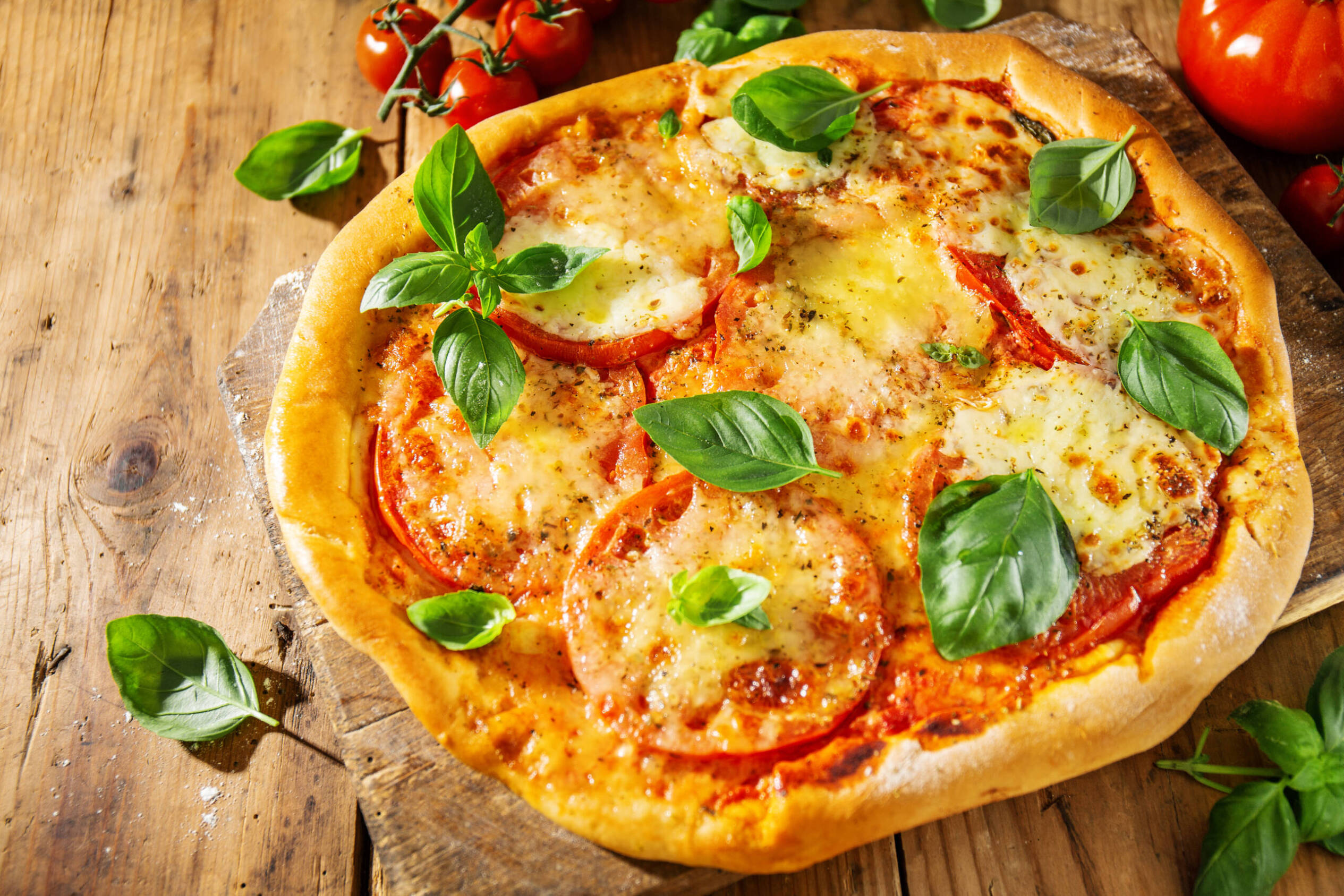 Homemade Pizza with fresh basil and tomato