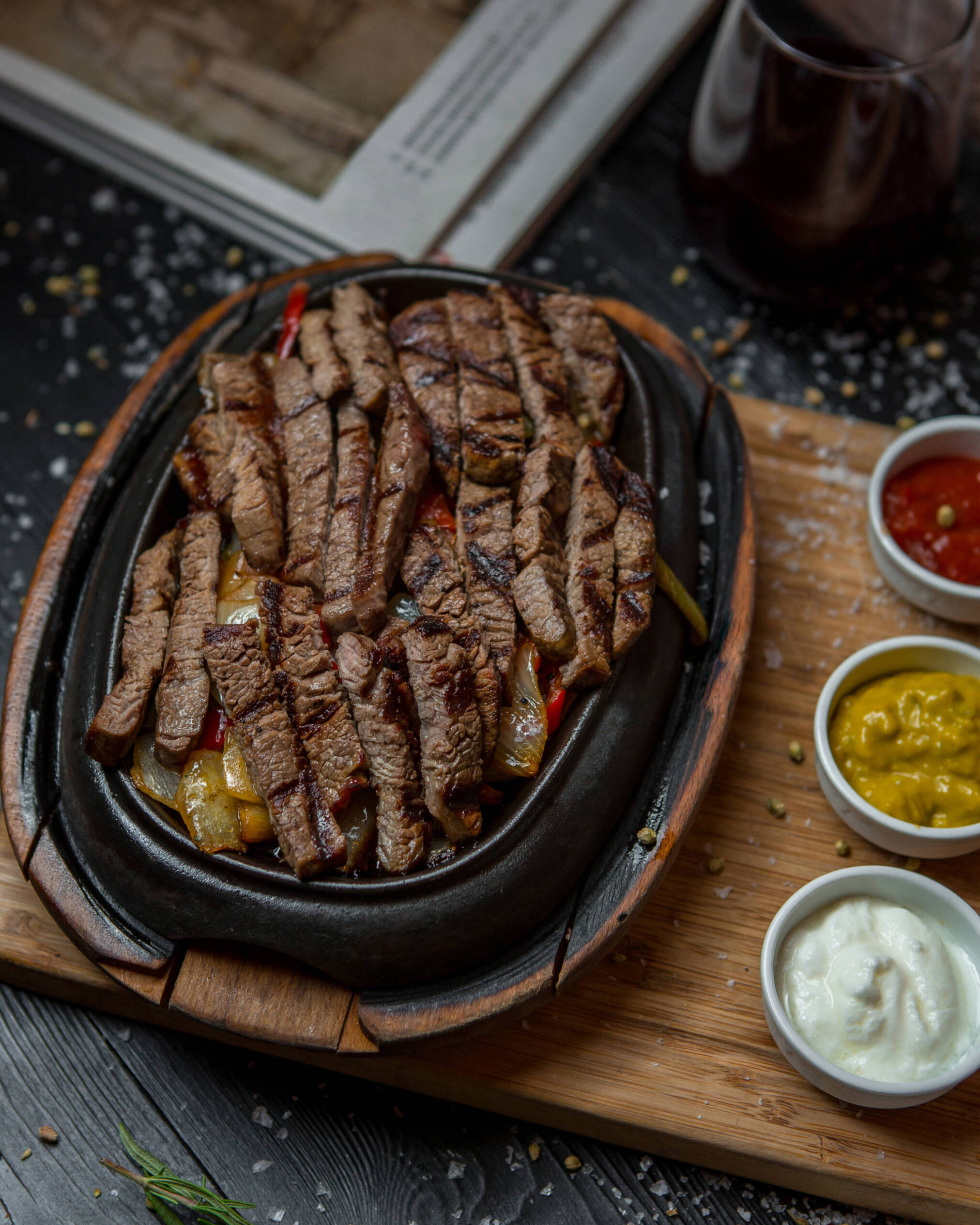 Fajita steak sliced thinly on a cutting board