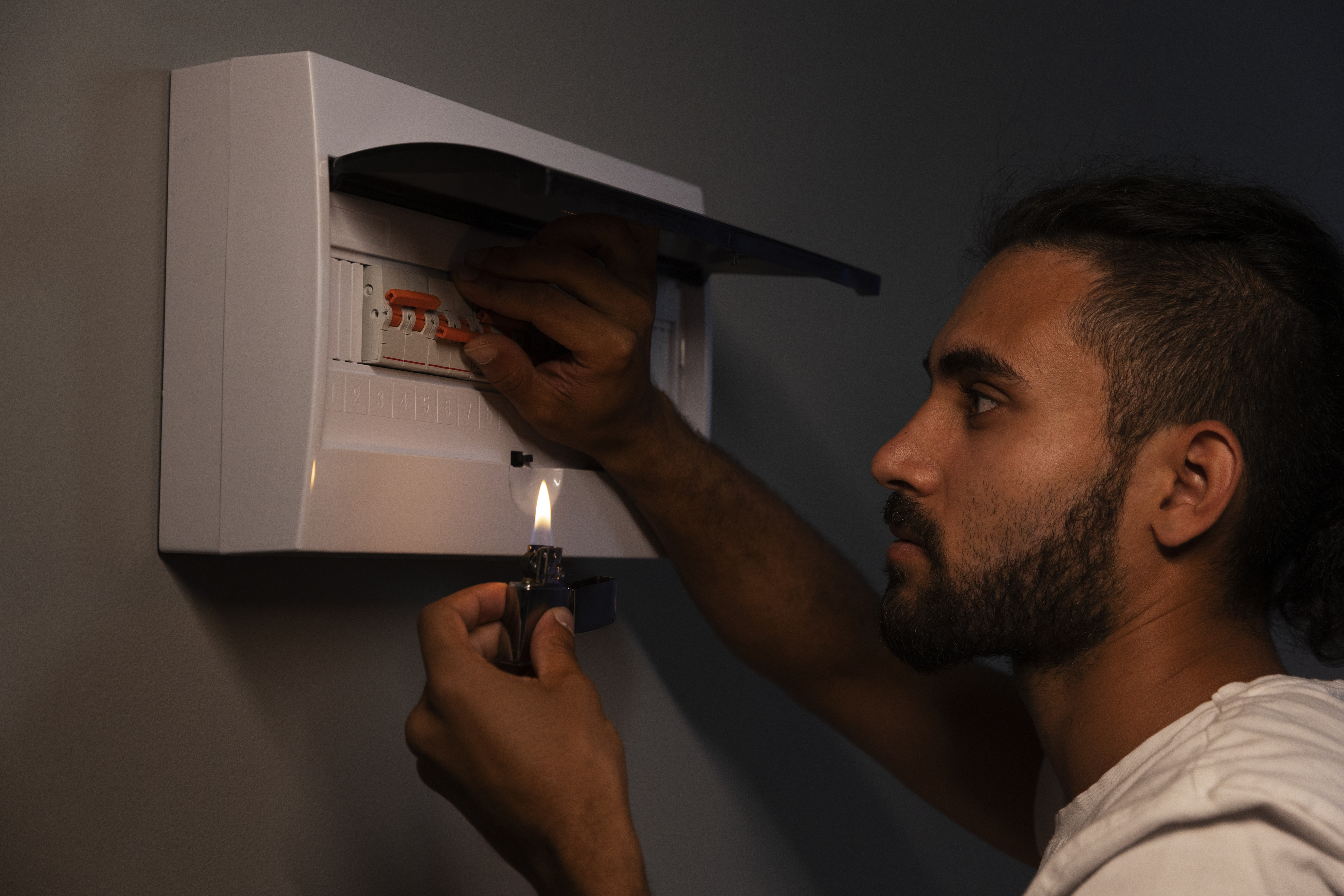 Man checking the power fuse box