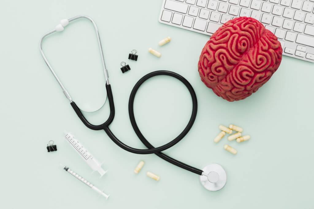 Stethoscope and brain with pills