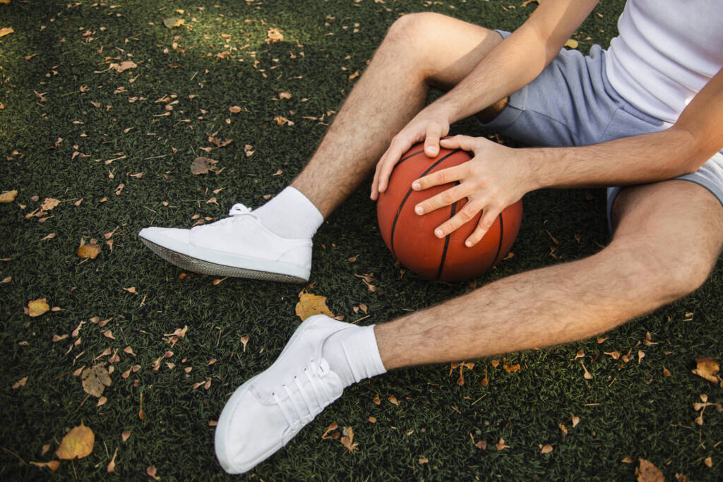 Man resting while playing basketball