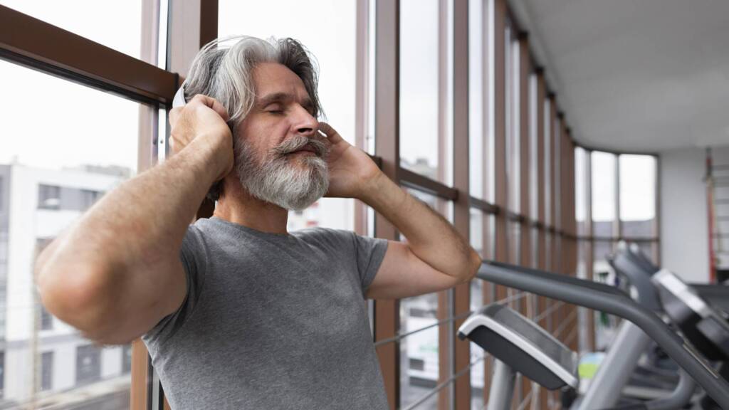 Man in gym with headphones