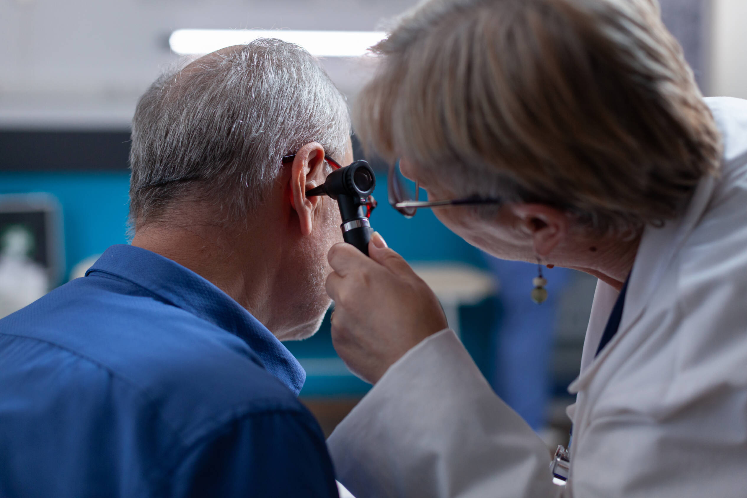Doctor examining ear stoppage issue