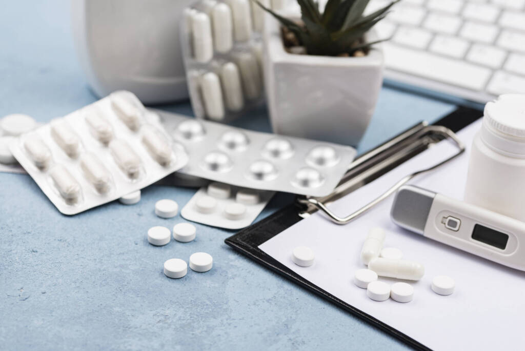 Strips of pills with an aloe plant