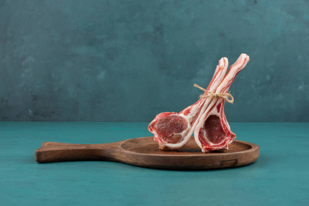 Lamb chops on a chopping board