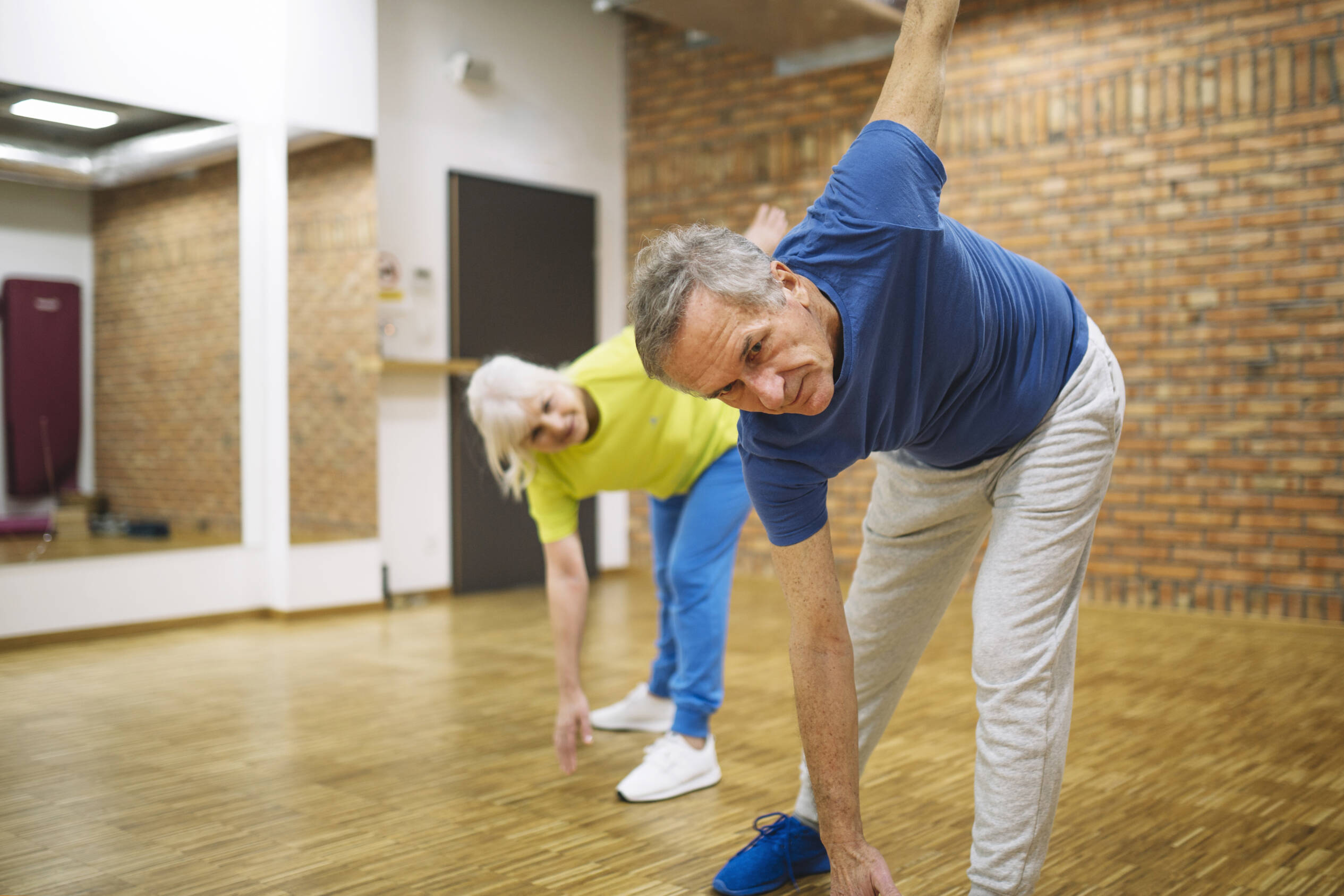 Mature couple exercising