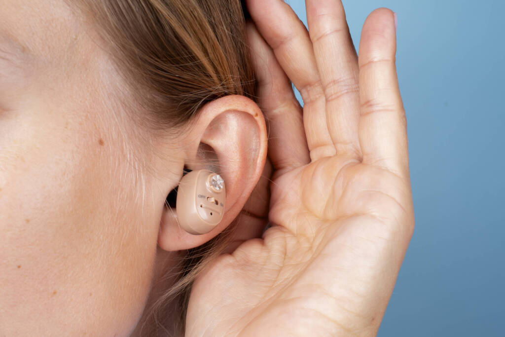 Woman with an ear aid