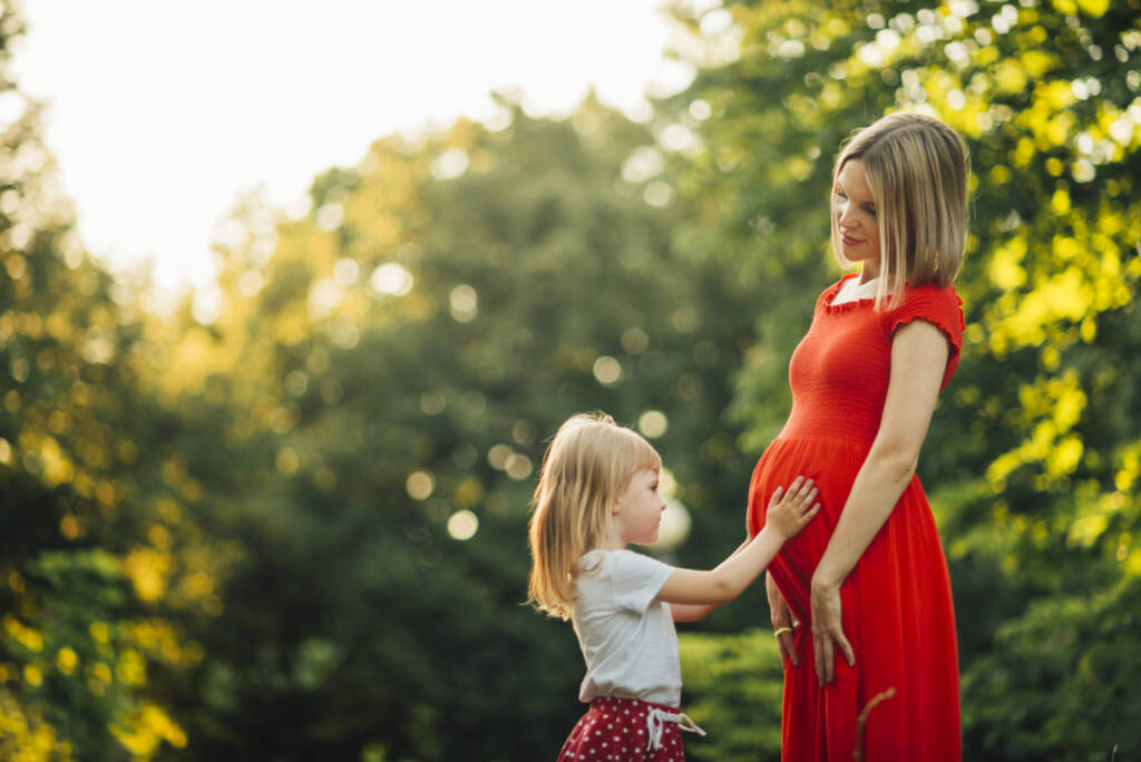 Pregnant mother with young child